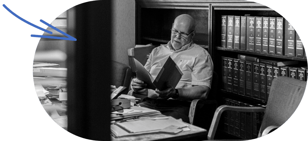 Lawyer reviewing documents in an office for home purchase or sale.