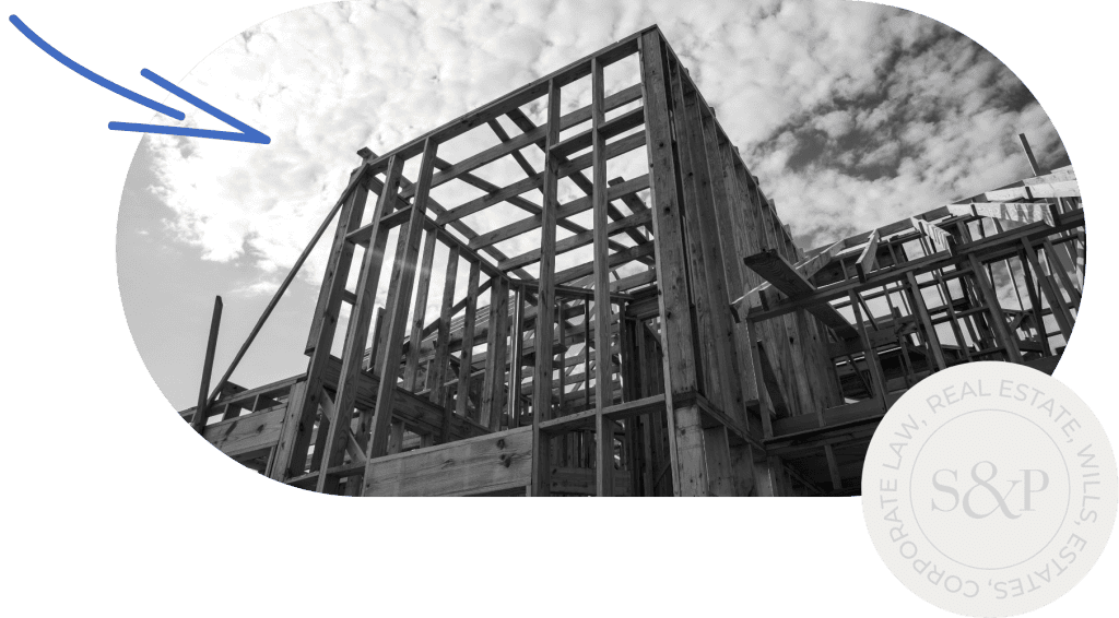 Wooden building frame in progress for new construction project.