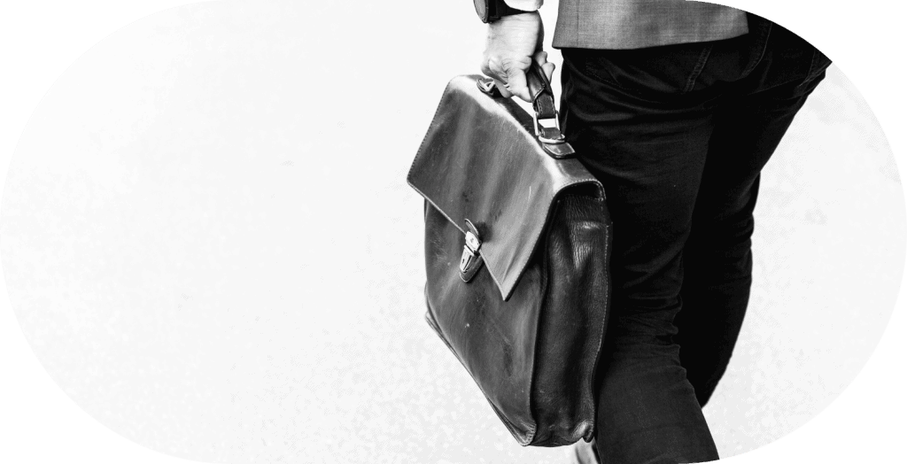 Business professional holding briefcase, preparing legal documents.